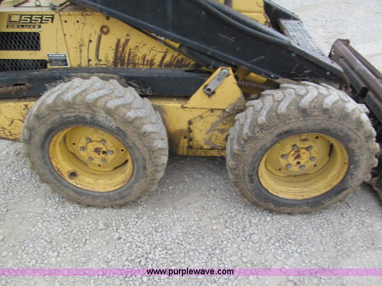 image for item E5770 1987 New Holland L555 Deluxe skid steer