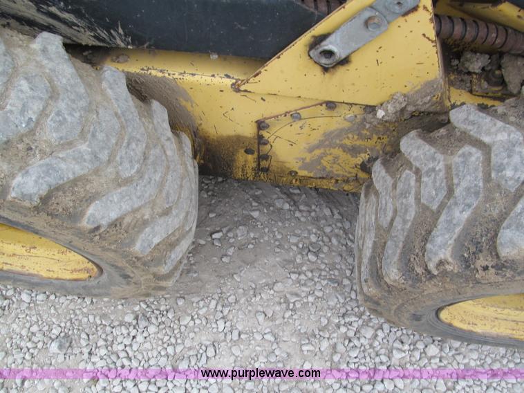 image for item E5770 1987 New Holland L555 Deluxe skid steer