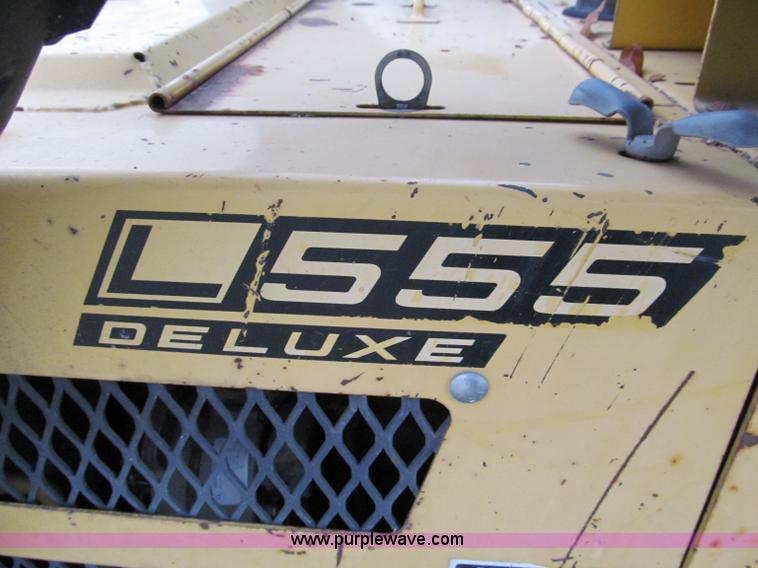 image for item E5770 1987 New Holland L555 Deluxe skid steer