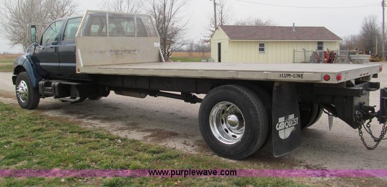 image for item E5833 2000 Ford F750 XLT quad cab flatbed truck