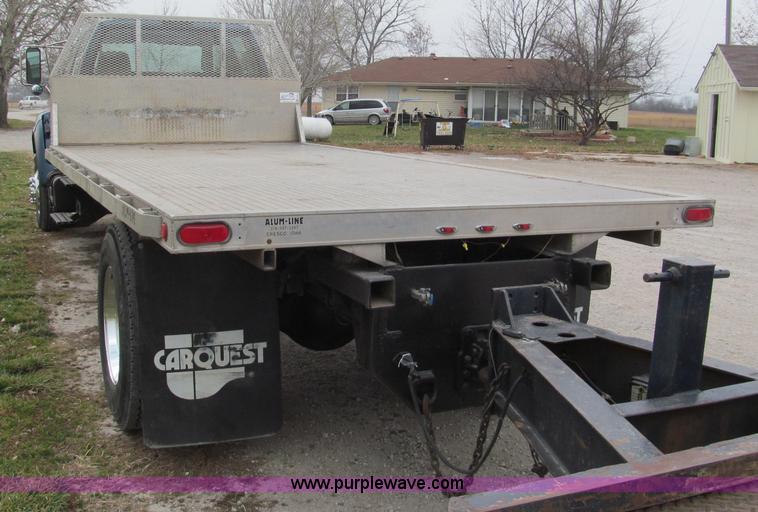image for item E5833 2000 Ford F750 XLT quad cab flatbed truck