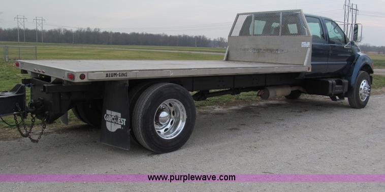 image for item E5833 2000 Ford F750 XLT quad cab flatbed truck