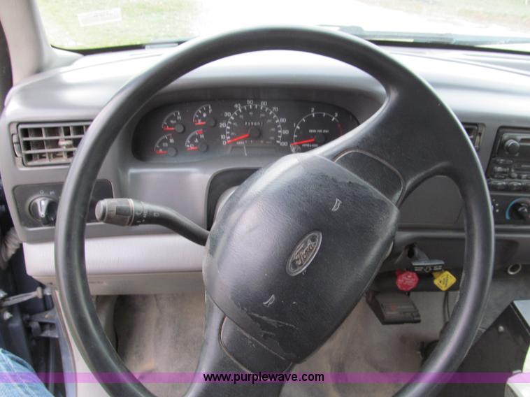 image for item E5833 2000 Ford F750 XLT quad cab flatbed truck