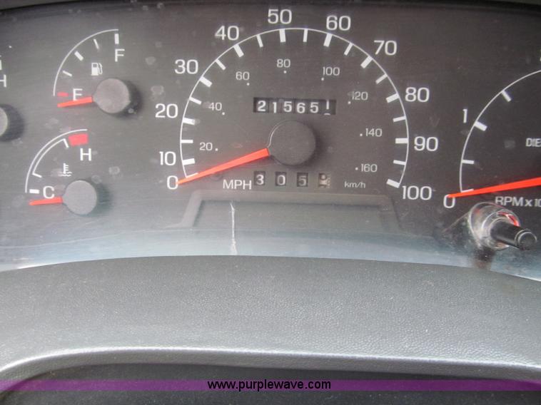 image for item E5833 2000 Ford F750 XLT quad cab flatbed truck