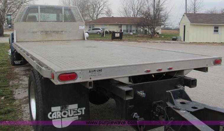 image for item E5833 2000 Ford F750 XLT quad cab flatbed truck