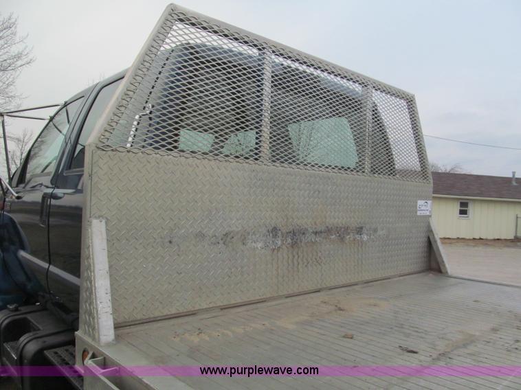 image for item E5833 2000 Ford F750 XLT quad cab flatbed truck