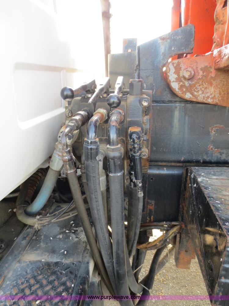 image for item F6557 1990 Mack DM690S roll-off truck