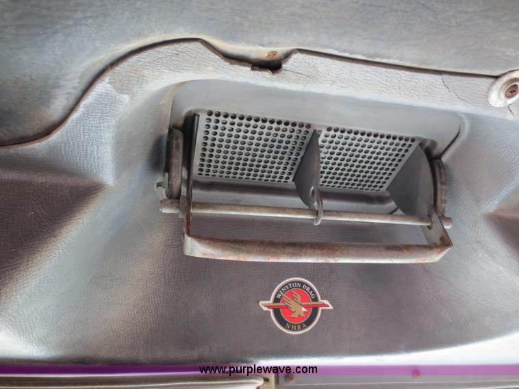 image for item F6557 1990 Mack DM690S roll-off truck