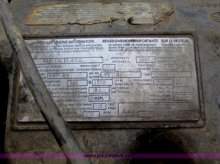 image for item F6557 1990 Mack DM690S roll-off truck