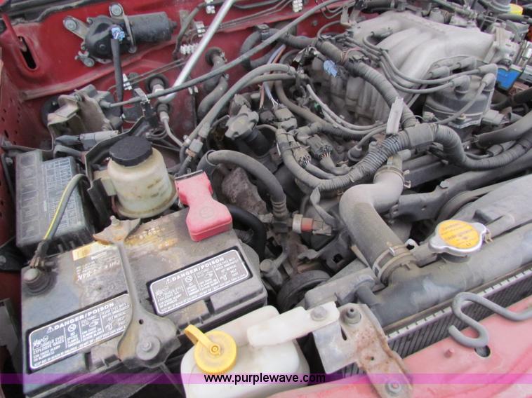 image for item E8282 2003 Nissan Frontier King Cab pickup truck