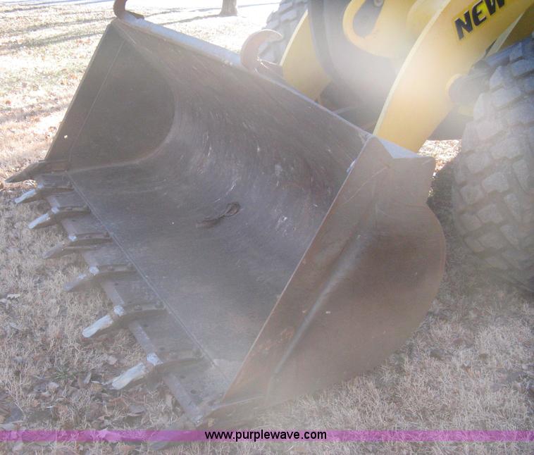 image for item B8469 2006 New Holland W110 wheel loader