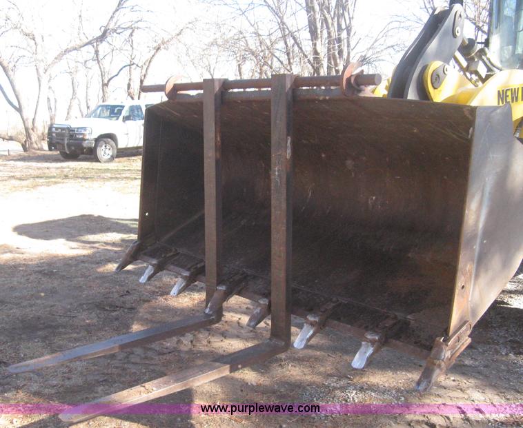 image for item B8469 2006 New Holland W110 wheel loader