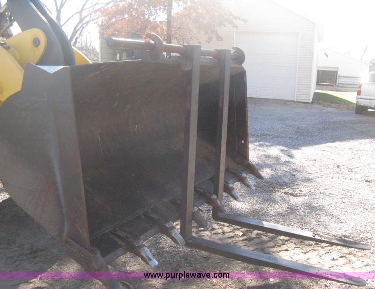 image for item B8469 2006 New Holland W110 wheel loader