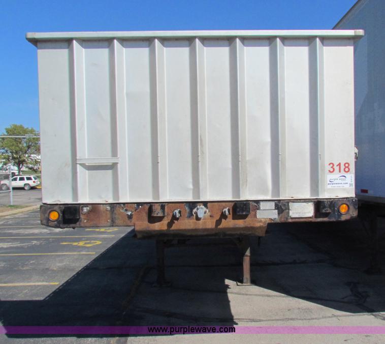 image for item E8121 1993 Transcraft 60 ton tandem axle flatbed trailer