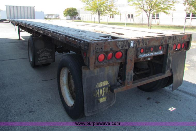 image for item E8121 1993 Transcraft 60 ton tandem axle flatbed trailer