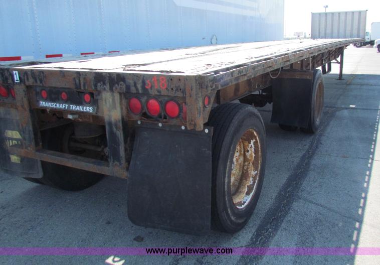image for item E8121 1993 Transcraft 60 ton tandem axle flatbed trailer
