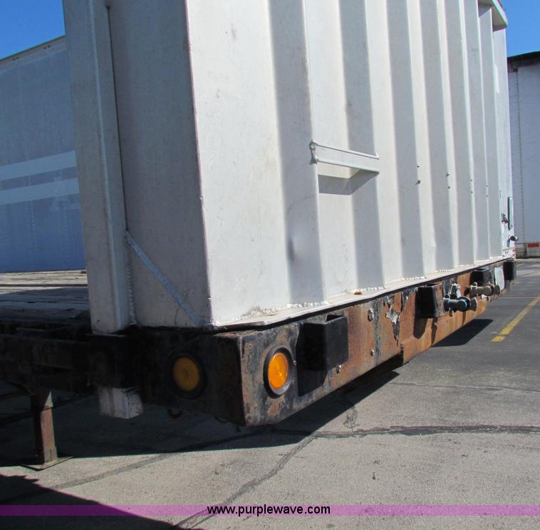 image for item E8121 1993 Transcraft 60 ton tandem axle flatbed trailer