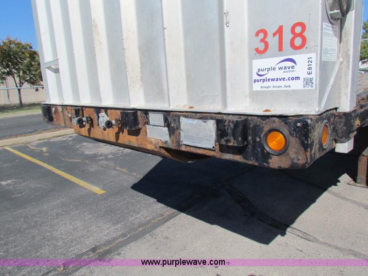 image for item E8121 1993 Transcraft 60 ton tandem axle flatbed trailer