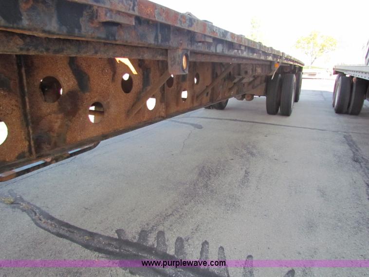 image for item E8121 1993 Transcraft 60 ton tandem axle flatbed trailer