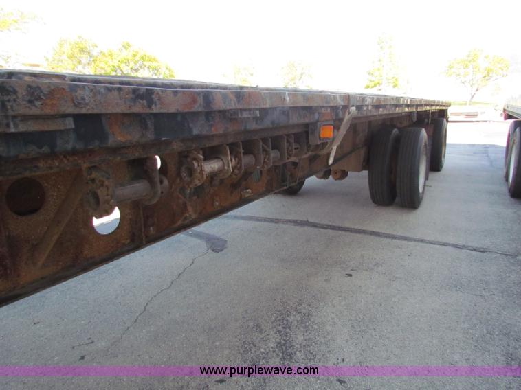 image for item E8121 1993 Transcraft 60 ton tandem axle flatbed trailer
