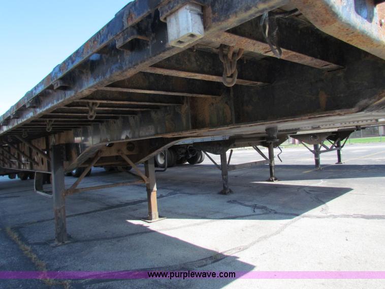 image for item E8121 1993 Transcraft 60 ton tandem axle flatbed trailer