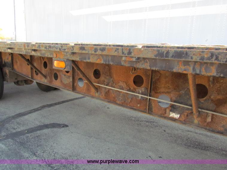 image for item E8121 1993 Transcraft 60 ton tandem axle flatbed trailer