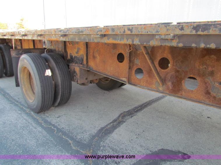 image for item E8121 1993 Transcraft 60 ton tandem axle flatbed trailer