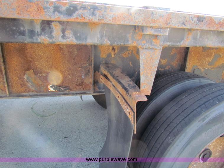 image for item E8121 1993 Transcraft 60 ton tandem axle flatbed trailer