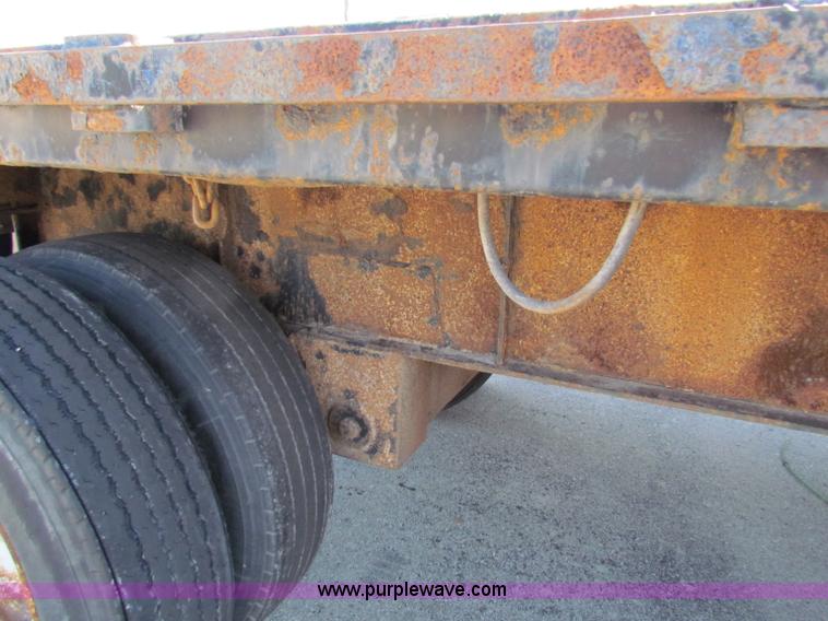 image for item E8121 1993 Transcraft 60 ton tandem axle flatbed trailer