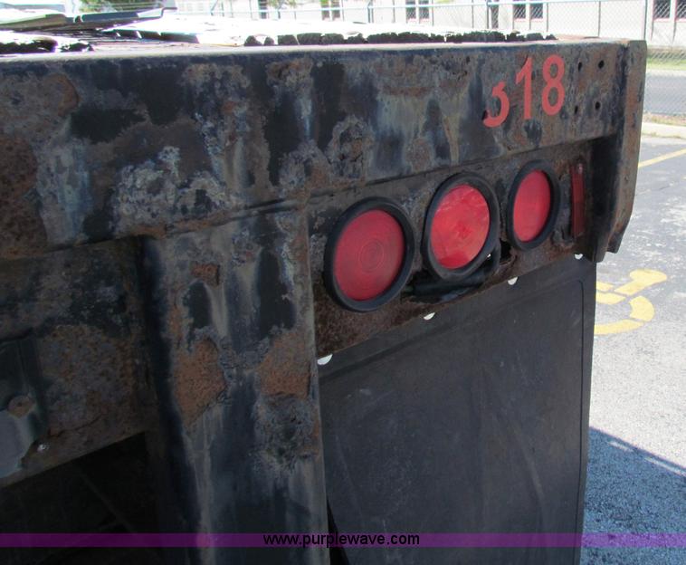 image for item E8121 1993 Transcraft 60 ton tandem axle flatbed trailer