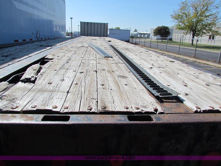 image for item E8121 1993 Transcraft 60 ton tandem axle flatbed trailer