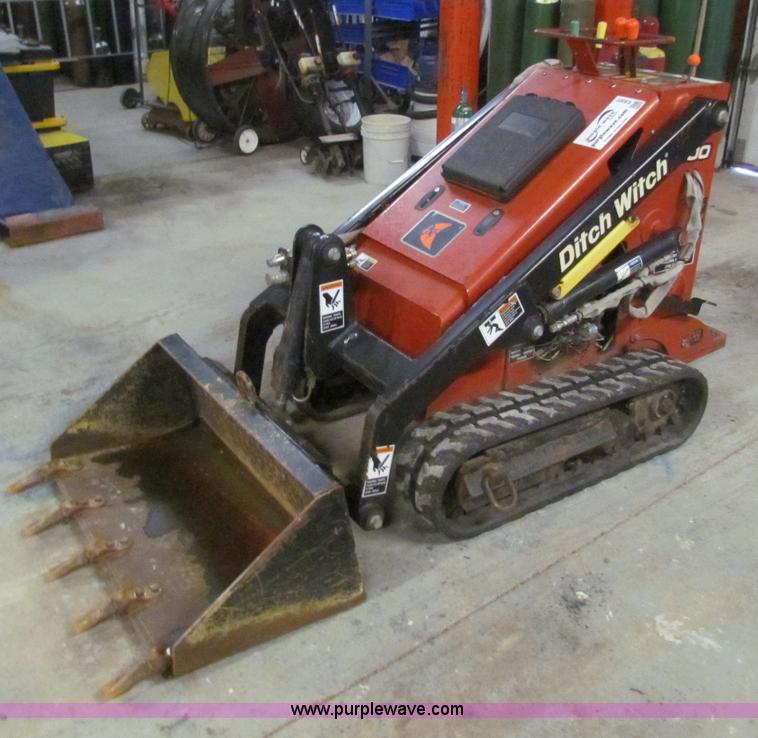 image for item E8307 Ditch Witch SK300 walk behind track loader