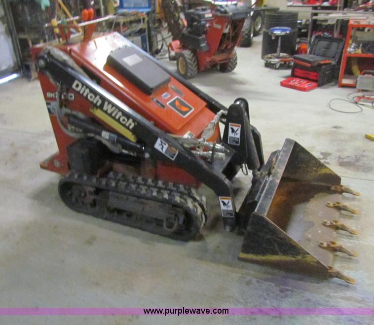 image for item E8307 Ditch Witch SK300 walk behind track loader