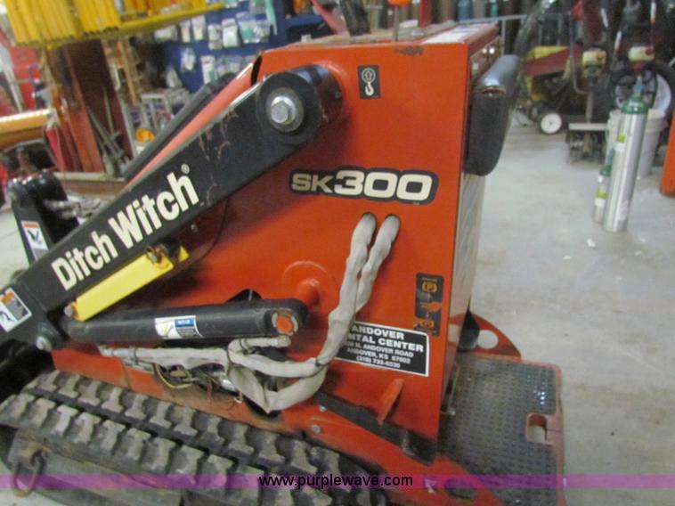 image for item E8307 Ditch Witch SK300 walk behind track loader