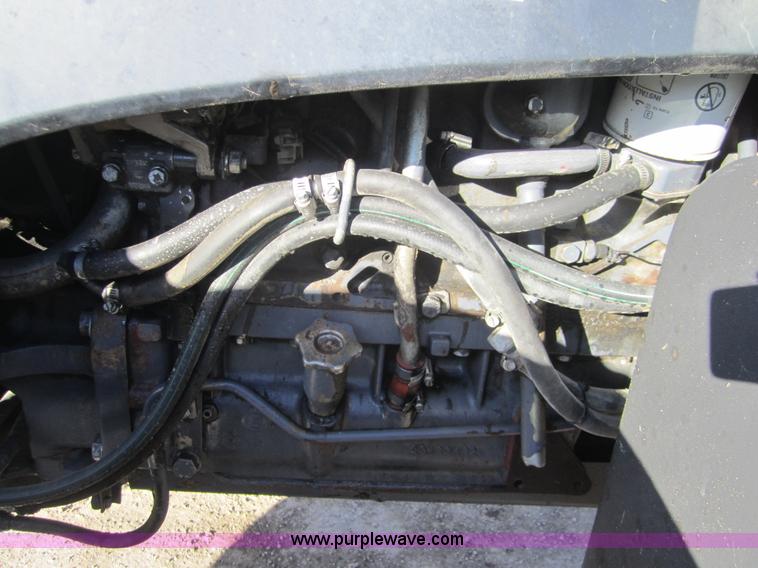 image for item F6569 1999 New Holland TL90 MFWD tractor