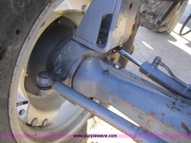 image for item F6569 1999 New Holland TL90 MFWD tractor