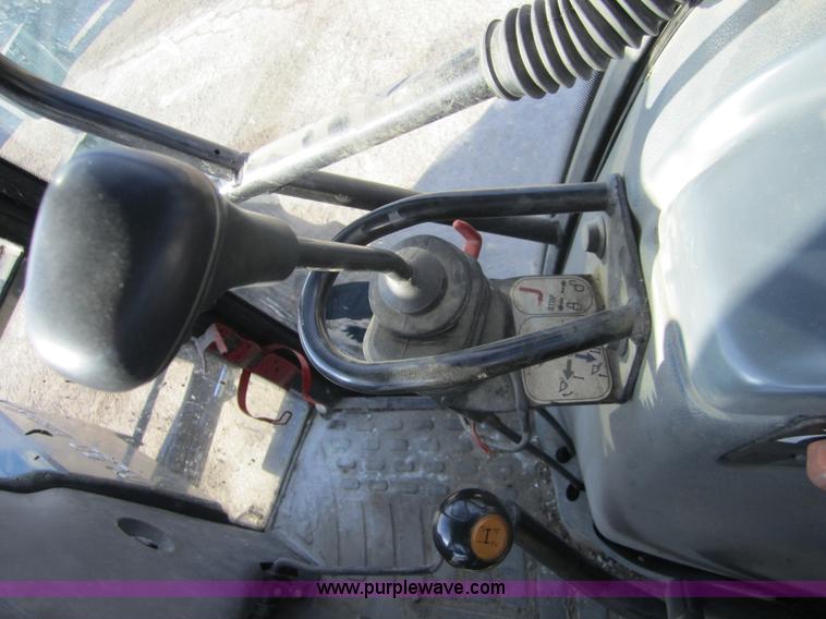 image for item F6569 1999 New Holland TL90 MFWD tractor