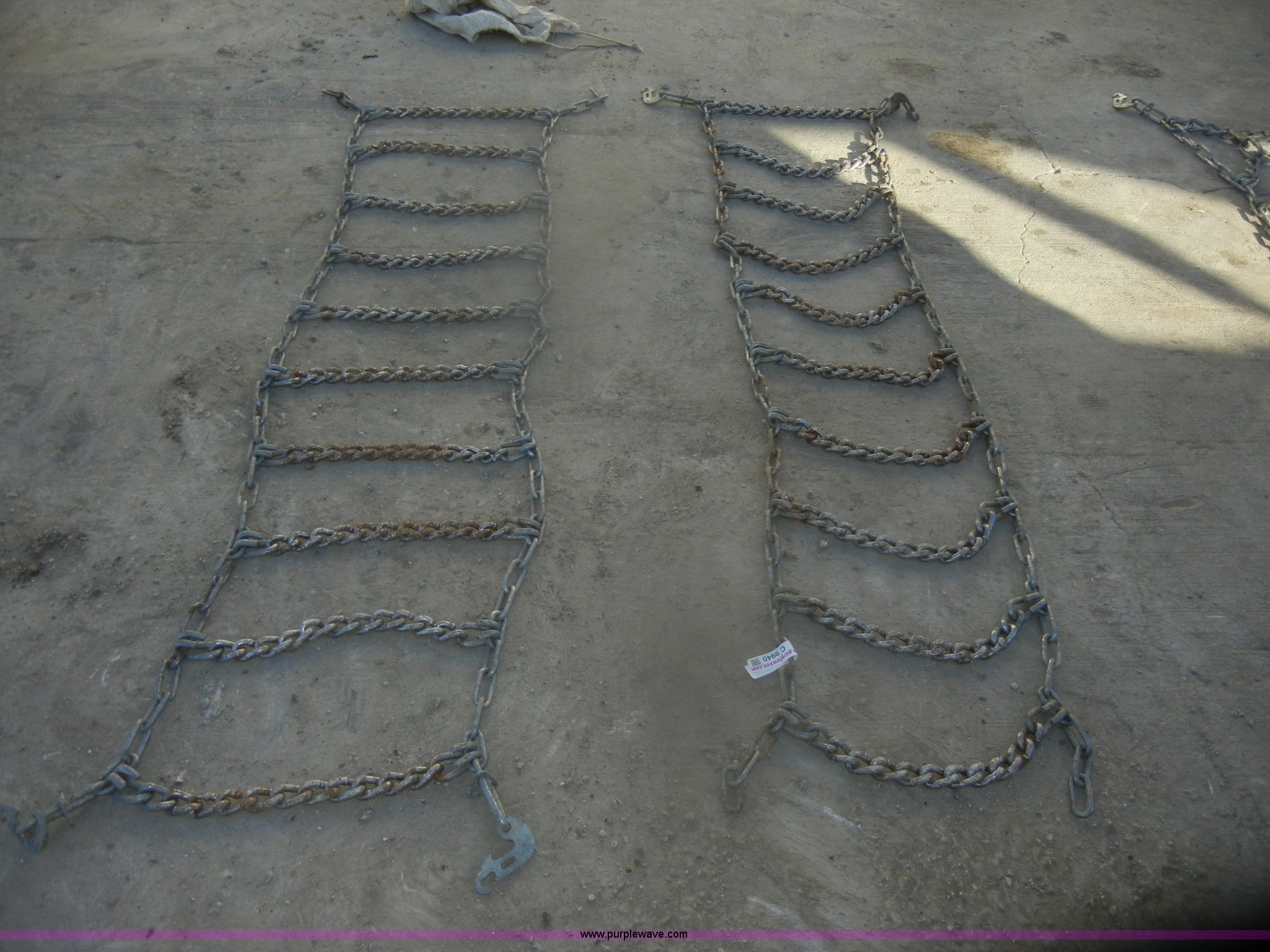 Skid steer chains in Hiawatha, KS Item C9940 sold Purple Wave