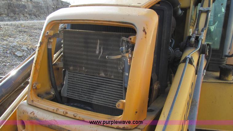 image for item E3641 1999 New Holland 675E backhoe