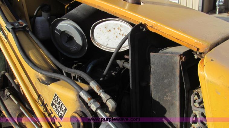 image for item E3641 1999 New Holland 675E backhoe