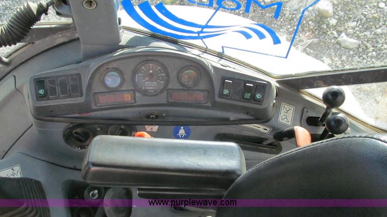 image for item E3641 1999 New Holland 675E backhoe