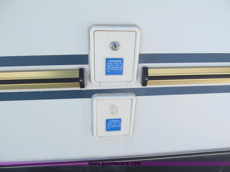 image for item E5870 1986 Chevrolet Imperial Holiday Rambler 33' RV