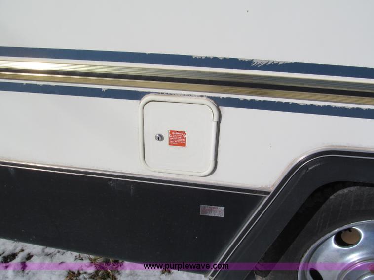 image for item E5870 1986 Chevrolet Imperial Holiday Rambler 33' RV