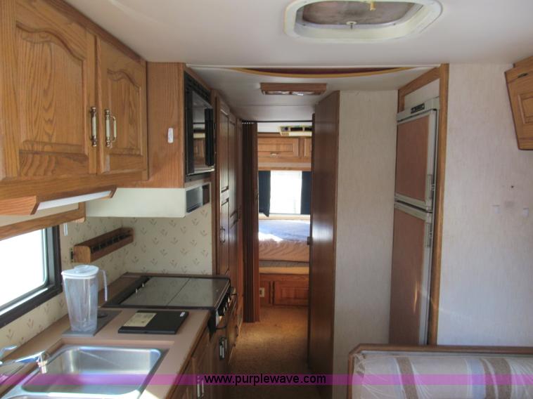 image for item E5870 1986 Chevrolet Imperial Holiday Rambler 33' RV