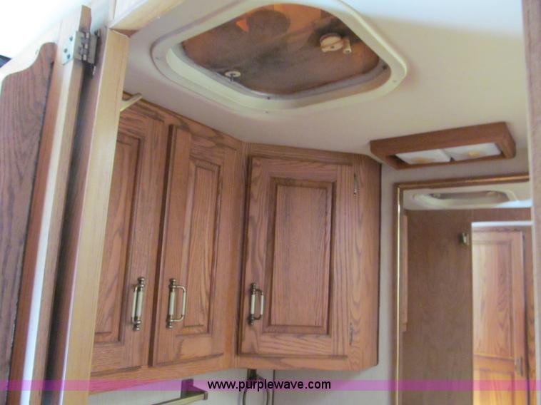 image for item E5870 1986 Chevrolet Imperial Holiday Rambler 33' RV