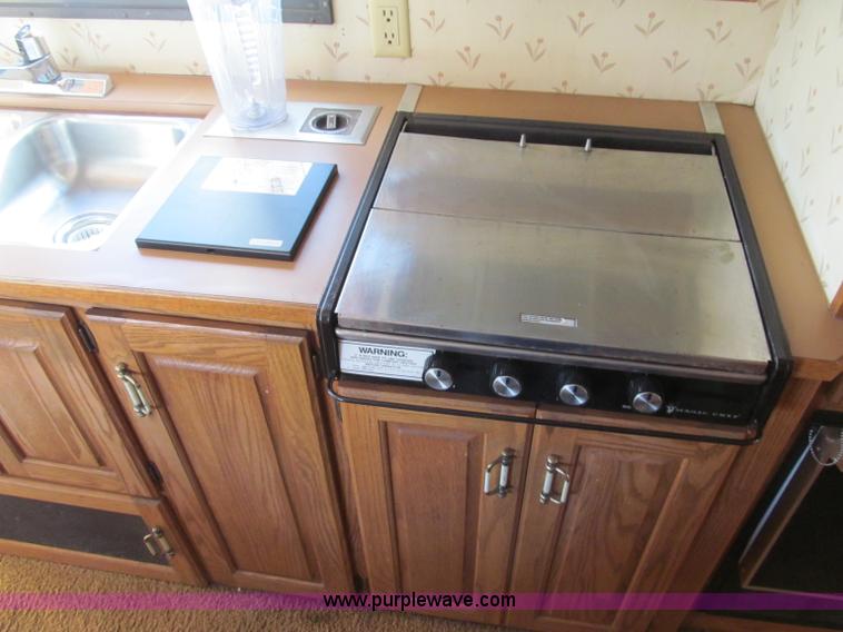 image for item E5870 1986 Chevrolet Imperial Holiday Rambler 33' RV