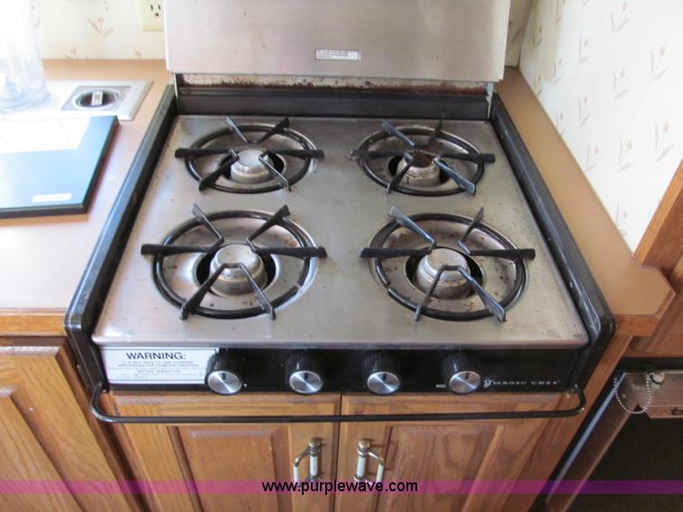 image for item E5870 1986 Chevrolet Imperial Holiday Rambler 33' RV