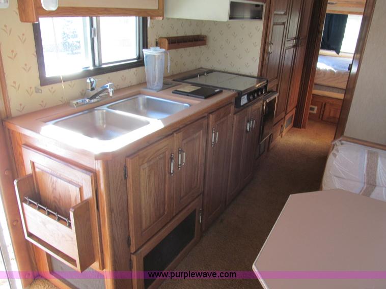 image for item E5870 1986 Chevrolet Imperial Holiday Rambler 33' RV