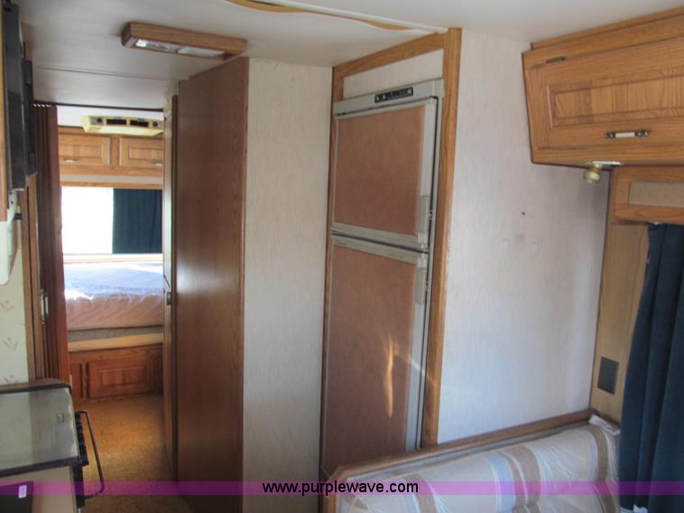 image for item E5870 1986 Chevrolet Imperial Holiday Rambler 33' RV