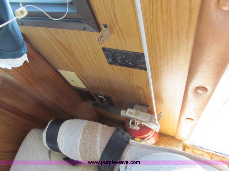 image for item E5870 1986 Chevrolet Imperial Holiday Rambler 33' RV